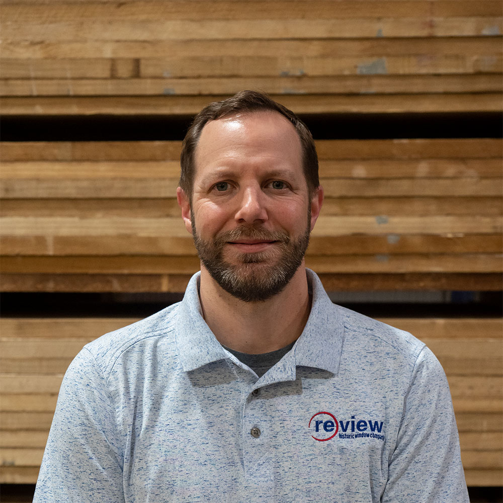 Branson Freeman stands in the Re-View wood shop.