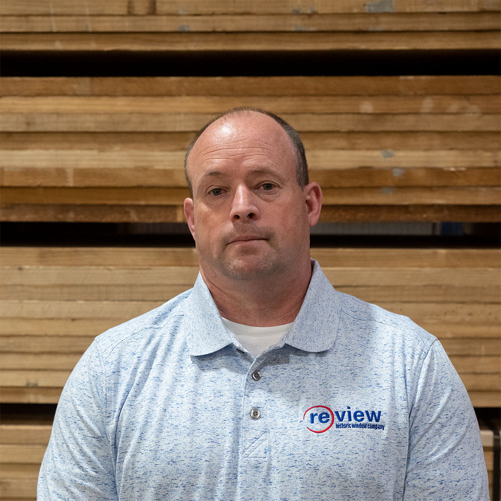 Joel McBee stands in the Re-View wood shop.