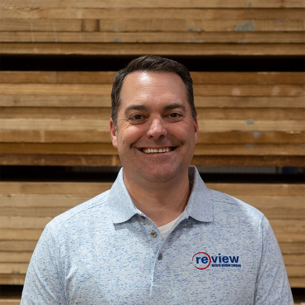 Miles Franz stands in the Re-View wood shop.