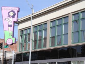 The DERMADoctor building from an angle with the sign in view.