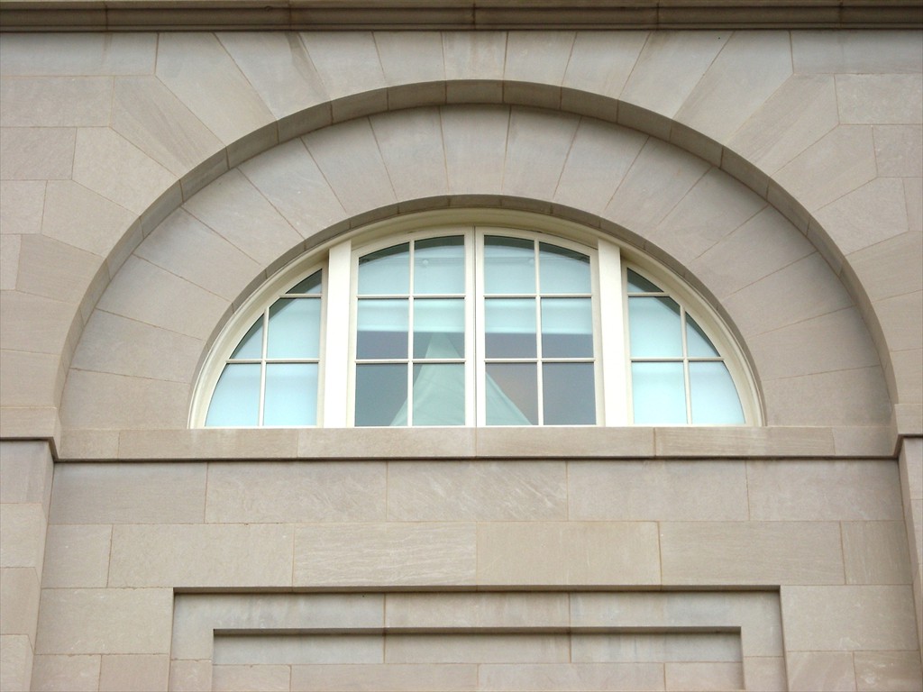 A restored arch window after installation.