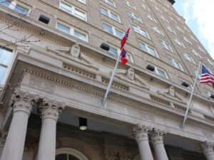 A perspective view looking up at the front of the King Edward Hotel.