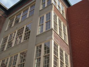 New windows on the Framingham Manufacturing Building seen from the outside.