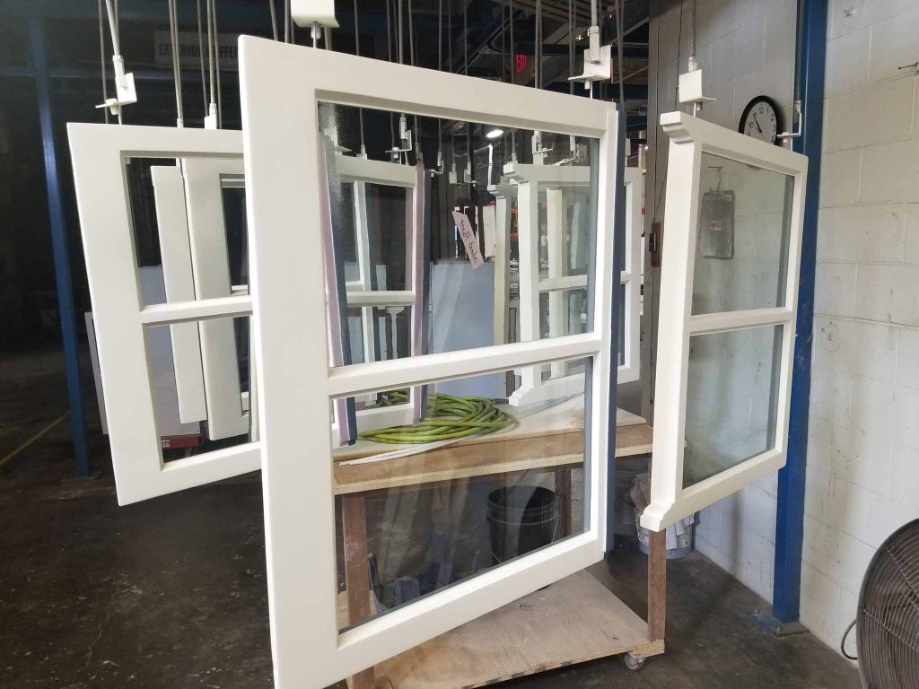 Restored windows hanging on the paint line.