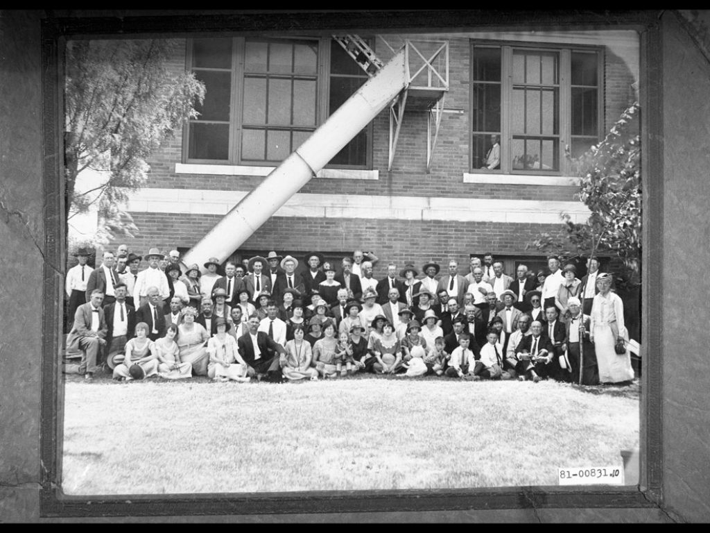 Historical black adn white photo of citizens outside the Taylor County Courthouse, Abilene, TX