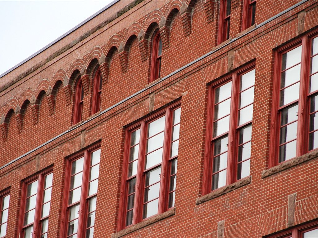 An exterior view of various windows installed on The Academy School.