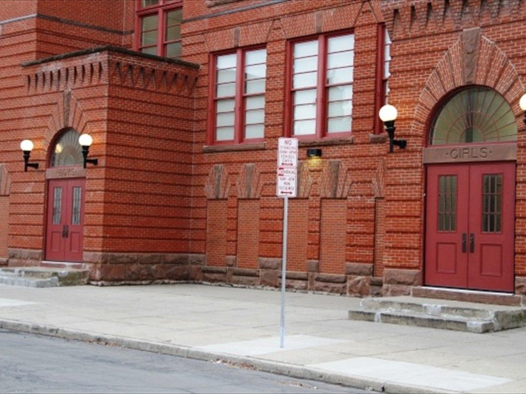 A close up of the front facade of The Academy School.
