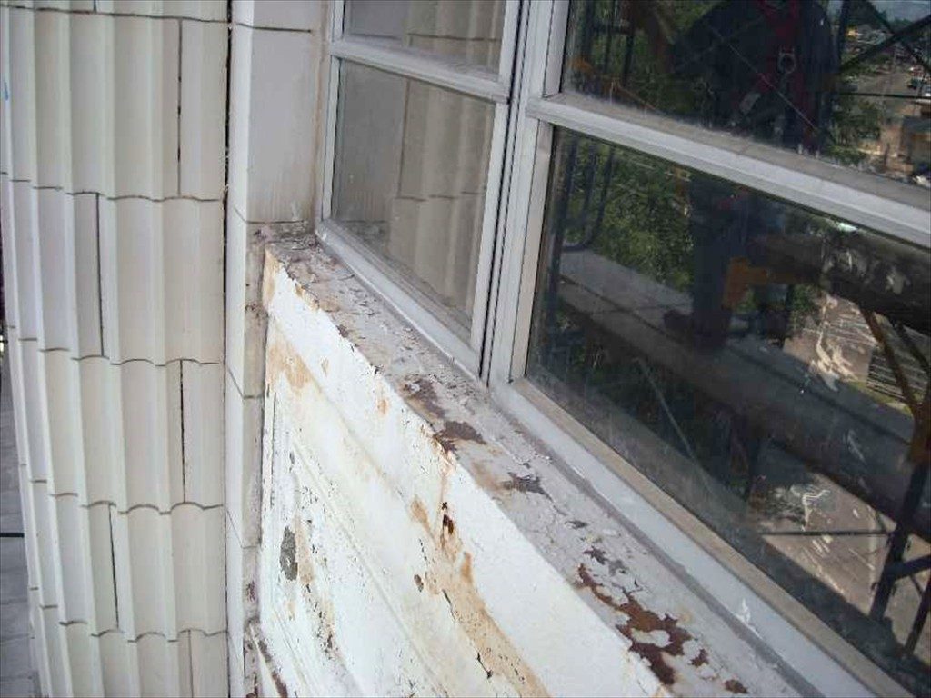A worn out window on Meridian City Hall prior to restoration.