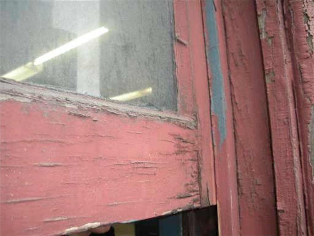 A detailed view of a worn out window on Thomas Hunter Hall in New York.