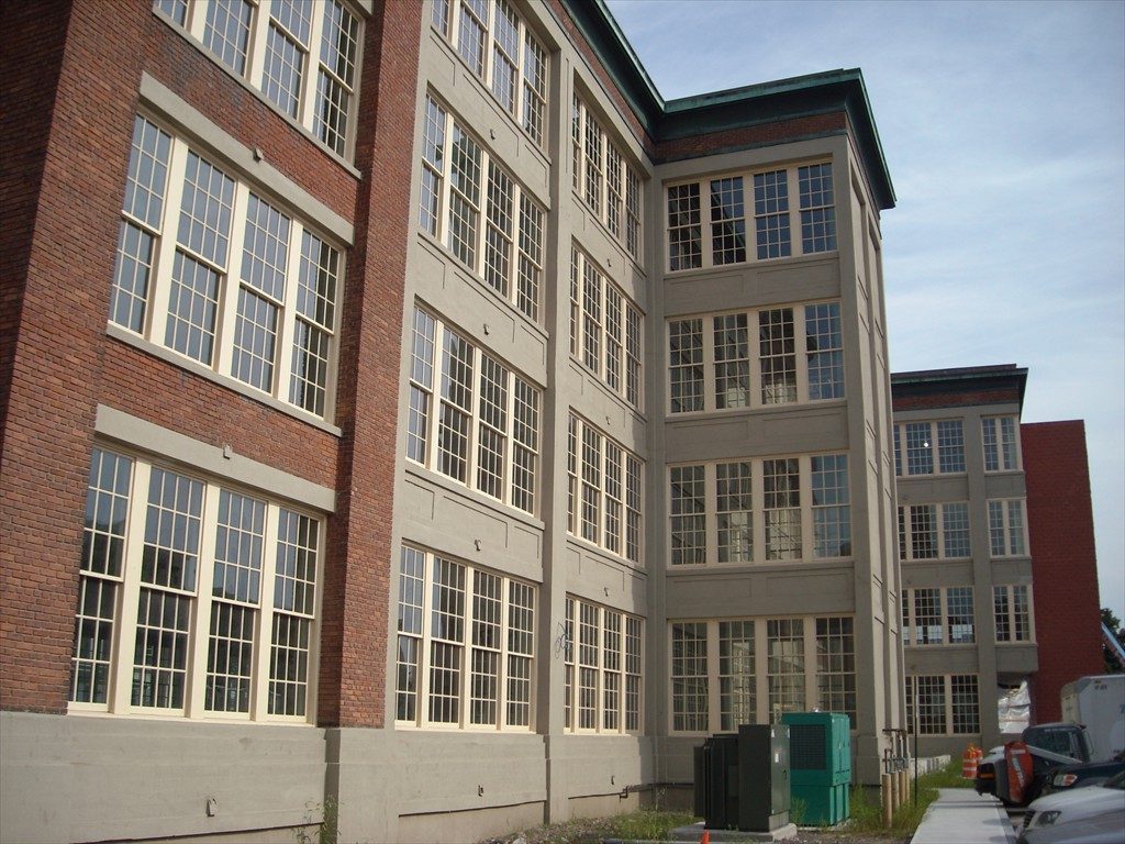 New windows on the Framingham Manufacturing Building seen from the outside.