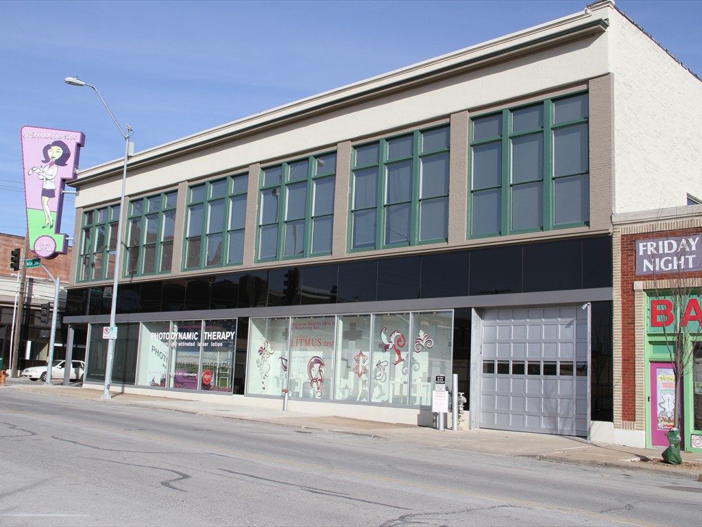 The DERMADoctor building from an angle with the sign in view.