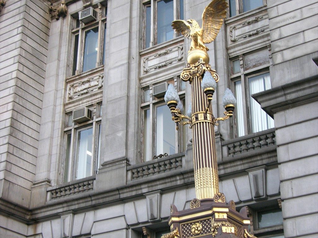 A front exterior view of various windows on Newark City Hall before restoration.