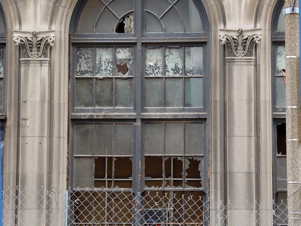 A large window in disrepair.