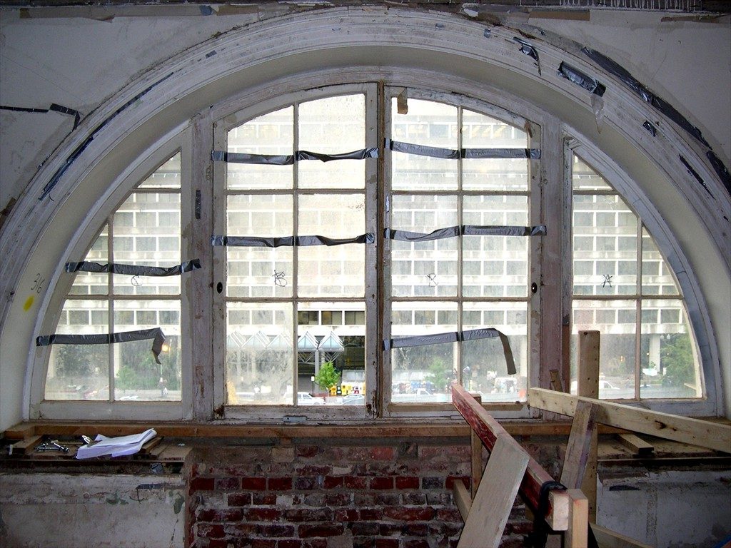Interior view of an old arch window prior to restoration.
