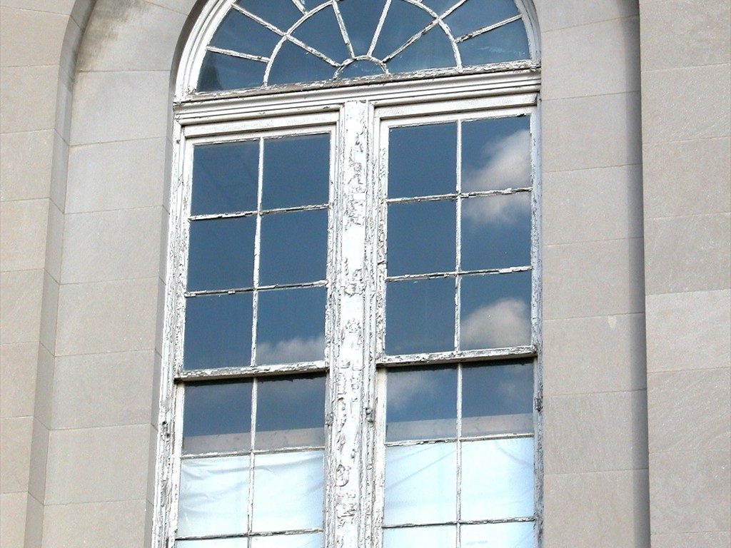An exterior view of a large window prior to installation.