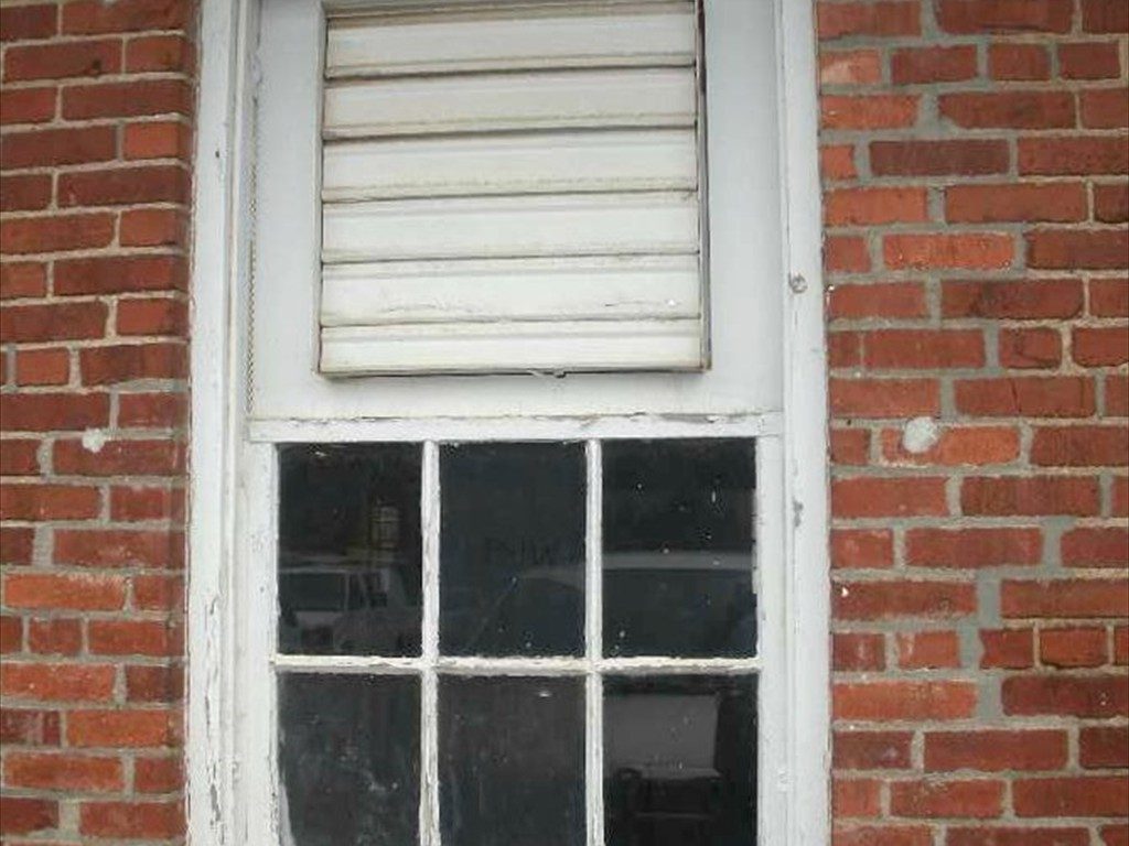 An old window on The Mule Barn before installation.